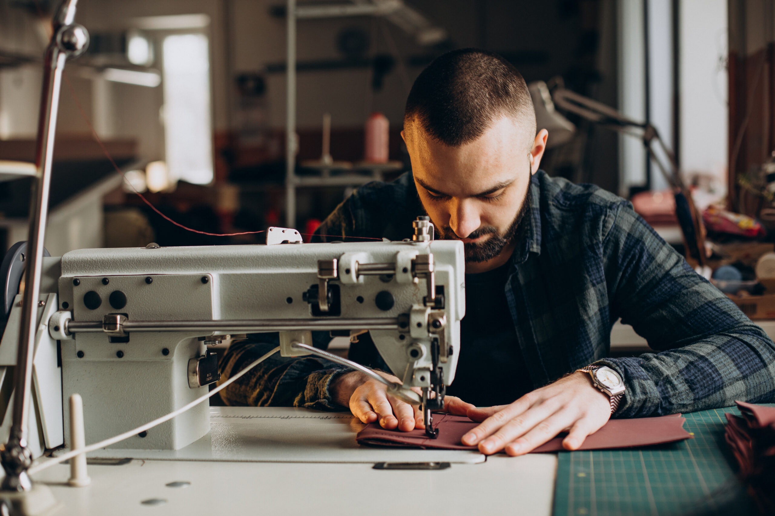 Male,Designer,And,Leather,Tailor,Working,At,A,Factory